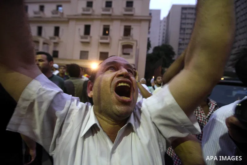 Supporters of Egypt's Muslim Brotherhood candidate Mohammed Mursi celebrate after the announcement of presidential election results in Cairo on June 18, 2012. The campaign of Egyptian presidential candidate Ahmed Shafiq...