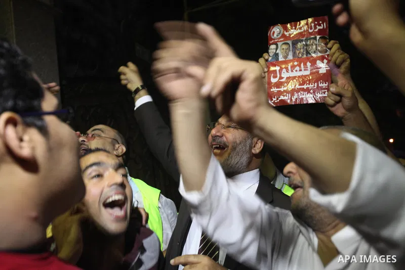 Supporters of Egypt's Muslim Brotherhood candidate Mohammed Mursi celebrate after the announcement of presidential election results in Cairo on June 18, 2012. The campaign of Egyptian presidential candidate Ahmed Shafiq...