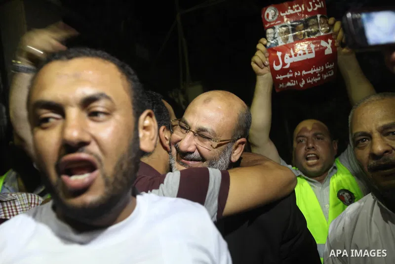Supporters of Egypt's Muslim Brotherhood candidate Mohammed Mursi celebrate after the announcement of presidential election results in Cairo on June 18, 2012. The campaign of Egyptian presidential candidate Ahmed Shafiq...