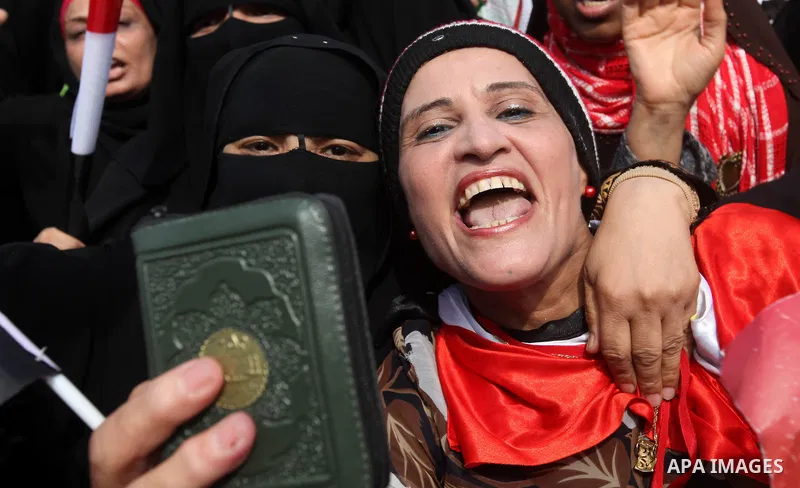 Supporters of presidential candidate Mohammed Morsi carry Egyptian and Muslim Brotherhood flags during celebrations claiming victory in Tahrir Square, Cairo, Egypt, Monday, June 18, 2012. The Muslim Brotherhood declared...