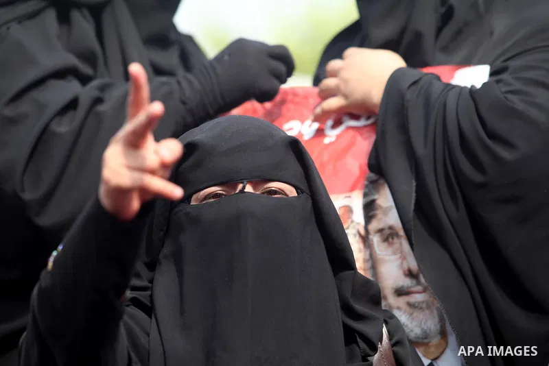 Supporters of presidential candidate Mohammed Morsi carry Egyptian and Muslim Brotherhood flags during celebrations claiming victory in Tahrir Square, Cairo, Egypt, Monday, June 18, 2012. The Muslim Brotherhood declared...