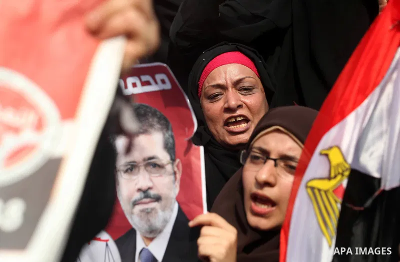 Supporters of presidential candidate Mohammed Morsi carry Egyptian and Muslim Brotherhood flags during celebrations claiming victory in Tahrir Square, Cairo, Egypt, Monday, June 18, 2012. The Muslim Brotherhood declared...
