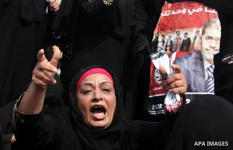 Supporters of presidential candidate Mohammed Morsi carry Egyptian and Muslim Brotherhood flags during celebrations claiming victory in Tahrir Square, Cairo, Egypt, Monday, June 18, 2012. The Muslim Brotherhood declared...