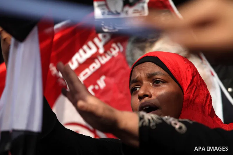 Supporters of presidential candidate Mohammed Morsi carry Egyptian and Muslim Brotherhood flags during celebrations claiming victory in Tahrir Square, Cairo, Egypt, Monday, June 18, 2012. The Muslim Brotherhood declared...
