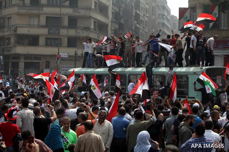Supporters of Egypt's Muslim Brotherhood candidate Mohammed Morsi celebrate in Tahrir square after the Brotherhood claimed win in presidential vote, in Cairo, Egypt, 18 June 2012. Hundreds of Muslim Brotherhood supporter...