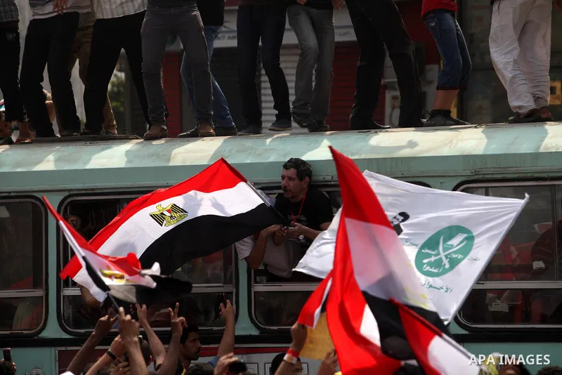 Supporters of Egypt's Muslim Brotherhood candidate Mohammed Morsi celebrate in Tahrir square after the Brotherhood claimed win in presidential vote, in Cairo, Egypt, 18 June 2012. Hundreds of Muslim Brotherhood supporter...