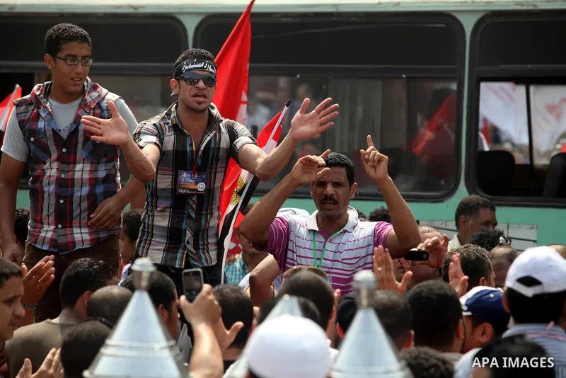 Supporters of Egypt's Muslim Brotherhood candidate Mohammed Morsi celebrate in Tahrir square after the Brotherhood claimed win in presidential vote, in Cairo, Egypt, 18 June 2012. Hundreds of Muslim Brotherhood supporter...