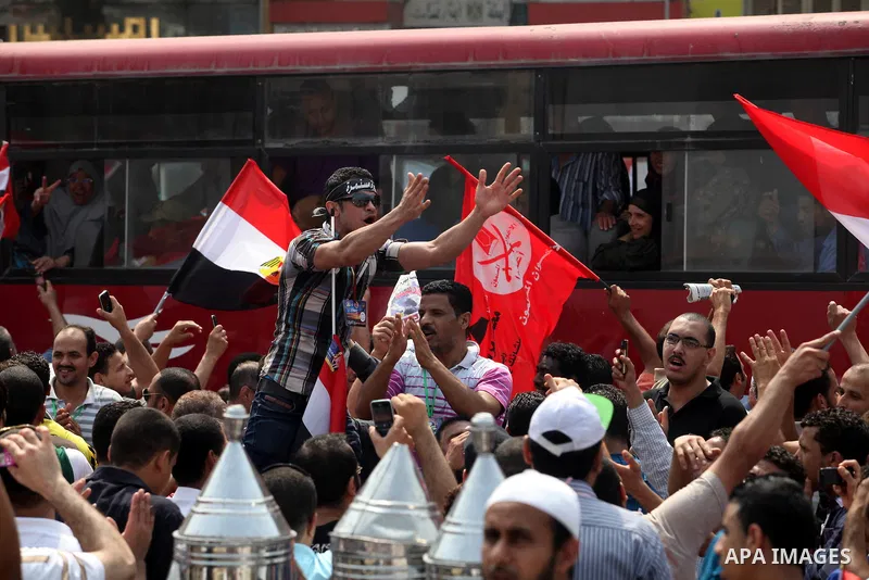 Supporters of Egypt's Muslim Brotherhood candidate Mohammed Morsi celebrate in Tahrir square after the Brotherhood claimed win in presidential vote, in Cairo, Egypt, 18 June 2012. Hundreds of Muslim Brotherhood supporter...