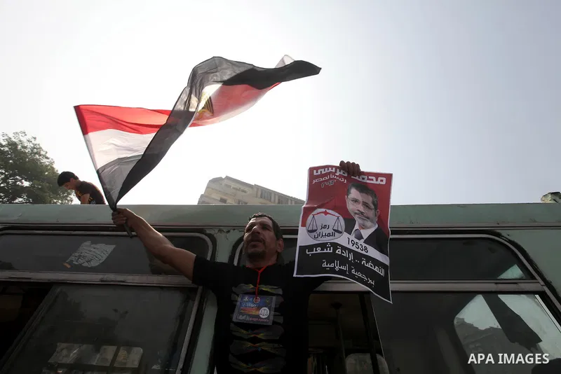 Supporters of Egypt's Muslim Brotherhood candidate Mohammed Morsi celebrate in Tahrir square after the Brotherhood claimed win in presidential vote, in Cairo, Egypt, 18 June 2012. Hundreds of Muslim Brotherhood supporter...
