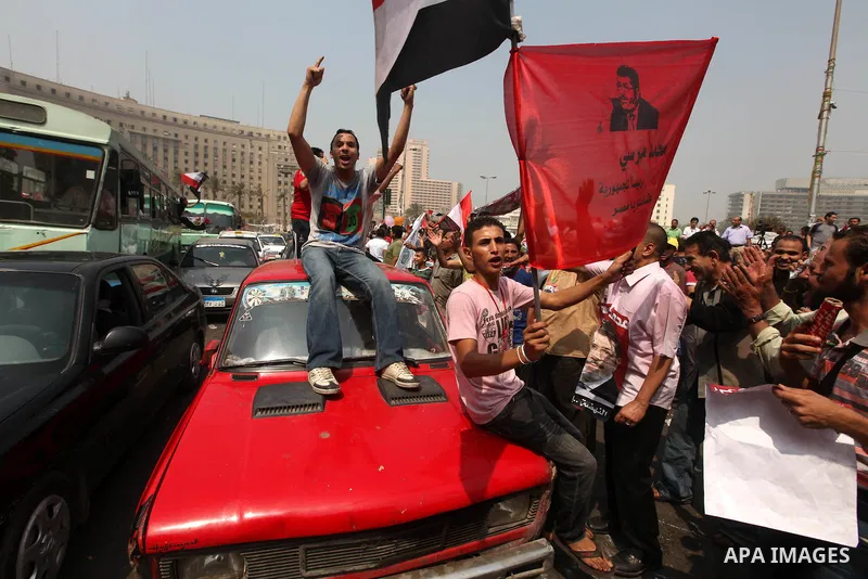 Supporters of Egypt's Muslim Brotherhood candidate Mohammed Morsi celebrate in Tahrir square after the Brotherhood claimed win in presidential vote, in Cairo, Egypt, 18 June 2012. Hundreds of Muslim Brotherhood supporter...
