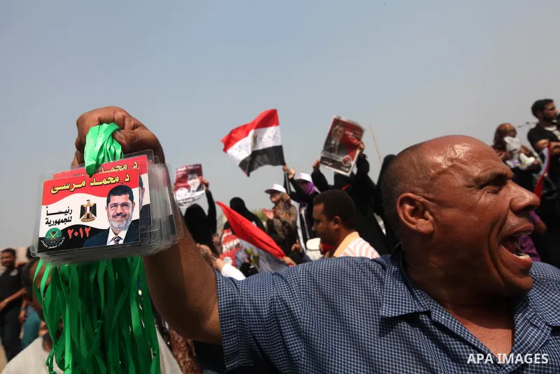 Supporters of Egypt's Muslim Brotherhood candidate Mohammed Morsi celebrate in Tahrir square after the Brotherhood claimed win in presidential vote, in Cairo, Egypt, 18 June 2012. Hundreds of Muslim Brotherhood supporter...