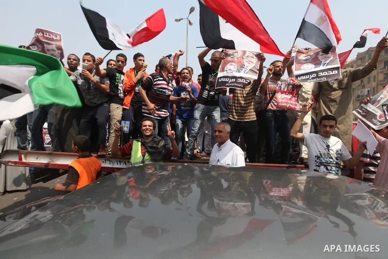 Supporters of Egypt's Muslim Brotherhood candidate Mohammed Morsi celebrate in Tahrir square after the Brotherhood claimed win in presidential vote, in Cairo, Egypt, 18 June 2012. Hundreds of Muslim Brotherhood supporter...