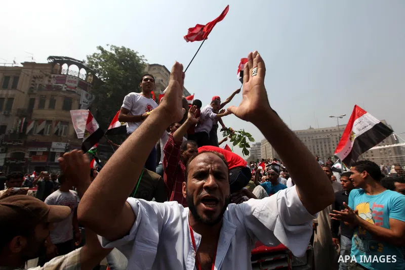 Supporters of Egypt's Muslim Brotherhood candidate Mohammed Morsi celebrate in Tahrir square after the Brotherhood claimed win in presidential vote, in Cairo, Egypt, 18 June 2012. Hundreds of Muslim Brotherhood supporter...