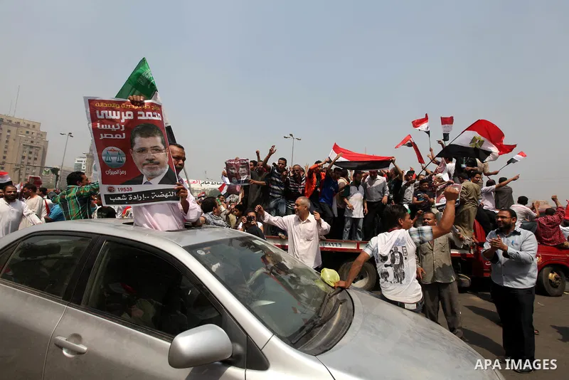 Supporters of Egypt's Muslim Brotherhood candidate Mohammed Morsi celebrate in Tahrir square after the Brotherhood claimed win in presidential vote, in Cairo, Egypt, 18 June 2012. Hundreds of Muslim Brotherhood supporter...