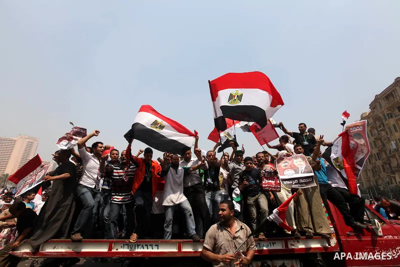 Supporters of Egypt's Muslim Brotherhood candidate Mohammed Morsi celebrate in Tahrir square after the Brotherhood claimed win in presidential vote, in Cairo, Egypt, 18 June 2012. Hundreds of Muslim Brotherhood supporter...