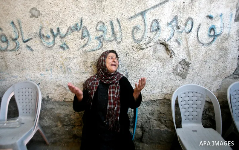 A relative of Palestinian militant Ismail Odeh mourns during his funeral in Beit Hanun in the northern Gaza Strip on June 18, 2012. Odeh was one of two Palestinians killed in an Israeli strike on north Gaza in the mornin...