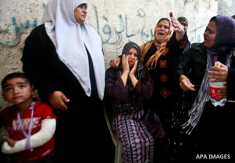 Relatives of Palestinian militant Ismail Odeh mourn during his funeral in Beit Hanun in the northern Gaza Strip on June 18, 2012. Odeh was one of two Palestinians killed in an Israeli strike on north Gaza in the morning,...