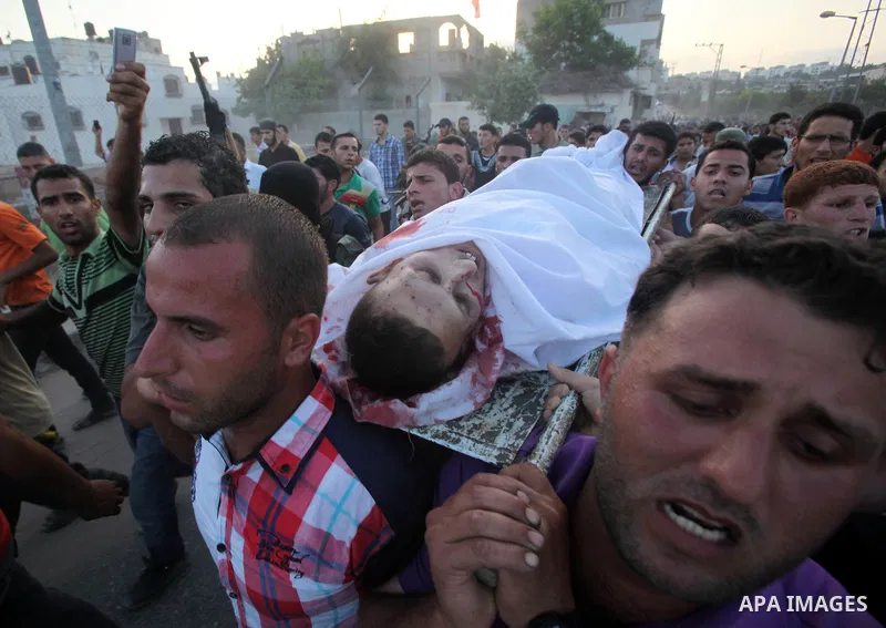 Palestinians carry the body of Abd El-Kareem Al-Za'aneen during his funeral after he was killed in an Israeli air strike near Beit Hanoun, northern Gaza Strip, Monday, June 18, 2012. The Israeli strike comes after killed...
