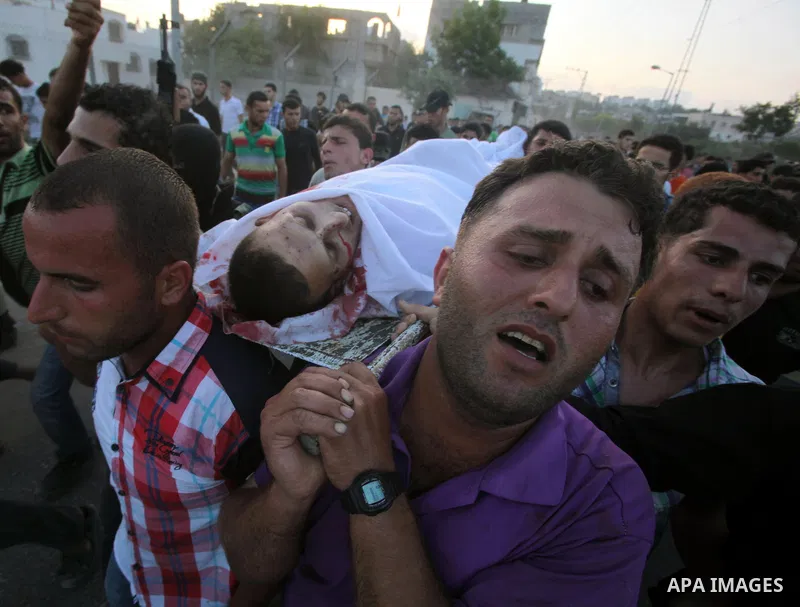 Palestinians carry the body of Abd El-Kareem Al-Za'aneen during his funeral after he was killed in an Israeli air strike near Beit Hanoun, northern Gaza Strip, Monday, June 18, 2012. The Israeli strike comes after killed...