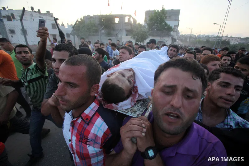 Palestinians carry the body of Abd El-Kareem Al-Za'aneen during his funeral after he was killed in an Israeli air strike near Beit Hanoun, northern Gaza Strip, Monday, June 18, 2012. The Israeli strike comes after killed...