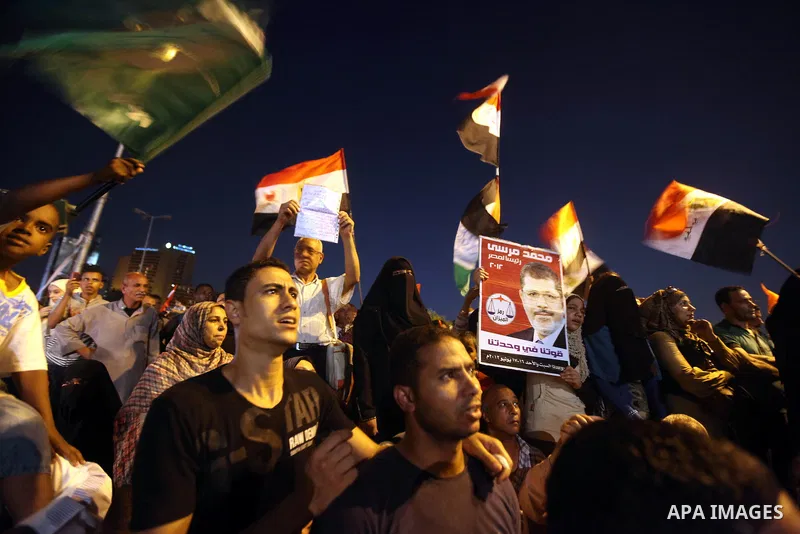 Supporters of Egypt's Muslim Brotherhood presidential candidate Mohammed Morsi celebrate after the Brotherhood claimed win in presidential vote, in Tahrir square, Cairo, Egypt, 18 June 2012. Hundreds of Muslim Brotherhoo...
