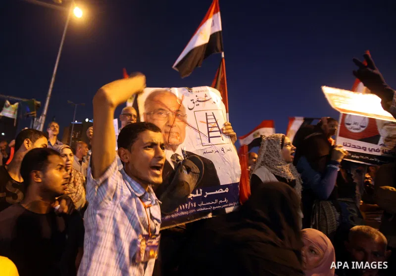 Supporters of Egypt's Muslim Brotherhood presidential candidate Mohammed Morsi celebrate after the Brotherhood claimed win in presidential vote, in Tahrir square, Cairo, Egypt, 18 June 2012. Hundreds of Muslim Brotherhoo...