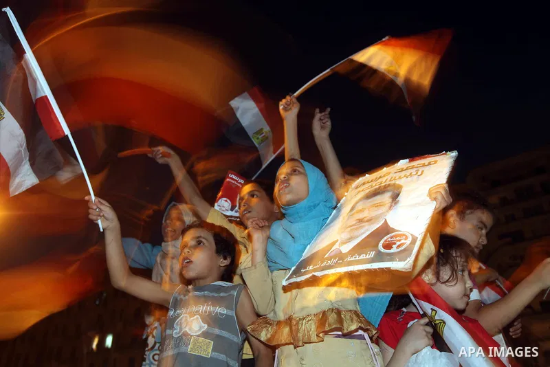 Supporters of Egypt's Muslim Brotherhood presidential candidate Mohammed Morsi celebrate after the Brotherhood claimed win in presidential vote, in Tahrir square, Cairo, Egypt, 18 June 2012. Hundreds of Muslim Brotherhoo...