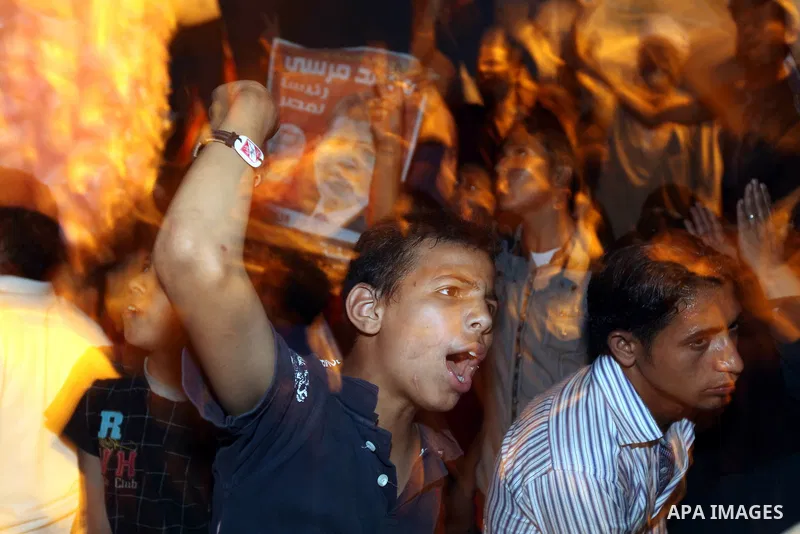 Supporters of Egypt's Muslim Brotherhood presidential candidate Mohammed Morsi celebrate after the Brotherhood claimed win in presidential vote, in Tahrir square, Cairo, Egypt, 18 June 2012. Hundreds of Muslim Brotherhoo...