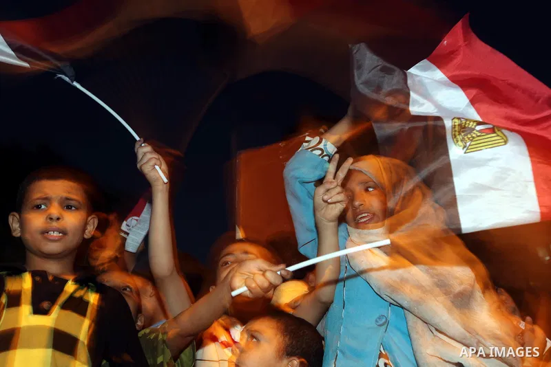 Supporters of Egypt's Muslim Brotherhood presidential candidate Mohammed Morsi celebrate after the Brotherhood claimed win in presidential vote, in Tahrir square, Cairo, Egypt, 18 June 2012. Hundreds of Muslim Brotherhoo...