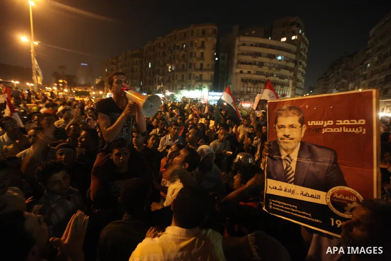Supporters of Egypt's Muslim Brotherhood presidential candidate Mohammed Morsi celebrate after the Brotherhood claimed win in presidential vote, in Tahrir square, Cairo, Egypt, 18 June 2012. Hundreds of Muslim Brotherhoo...