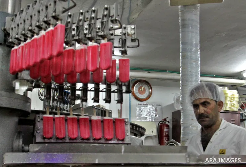 A Palestinian employee works at the Al-Arz ice cream factory in the West Bank City of Nablus on June 19, 2012. Photo by Nedal Eshtayah