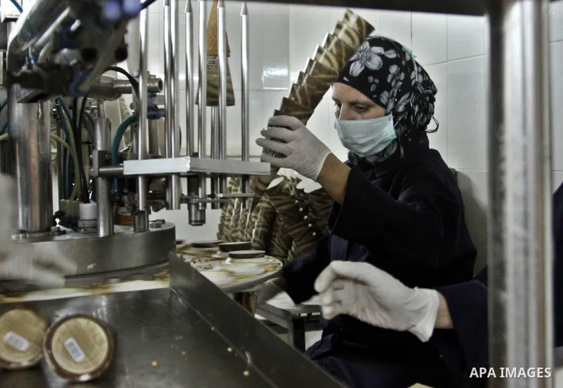 Palestinian women made pack ice cream cones at the Al-Arz ice cream factory in the West Bank City of Nablus on June 19, 2012. Photo by Nedal Eshtayah