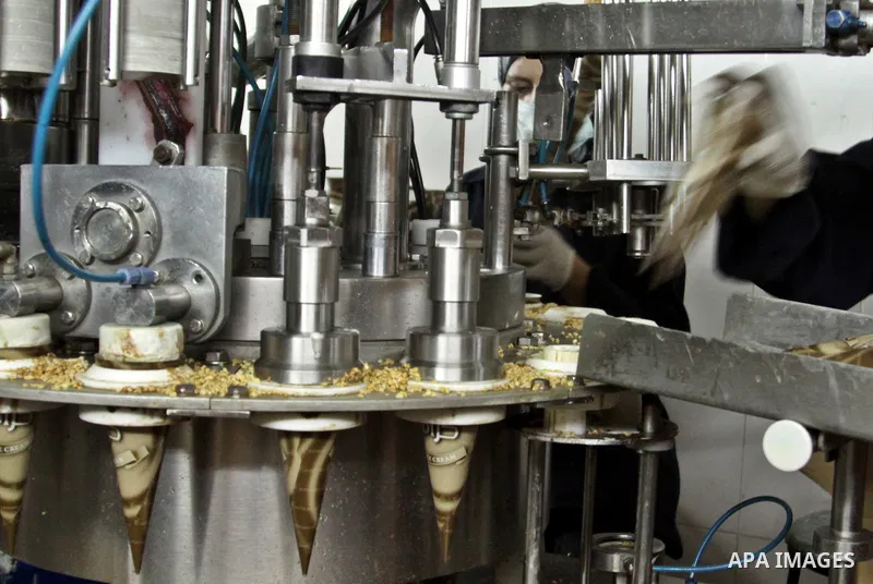 Palestinian women made pack ice cream cones at the Al-Arz ice cream factory in the West Bank City of Nablus on June 19, 2012. Photo by Nedal Eshtayah
