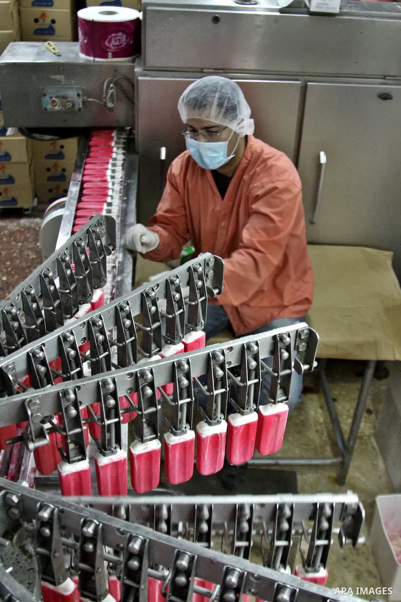 A Palestinian employee works at the Al-Arz ice cream factory in the West Bank City of Nablus on June 19, 2012. Photo by Nedal Eshtayah