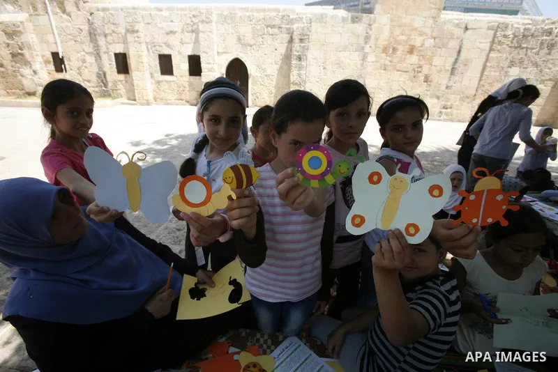 Palestinian children participate in summer camps at Al-Aqsa mosque in the old city of Jerusalem on 19 June 2012. Photo by Mahfouz Abu Turk
