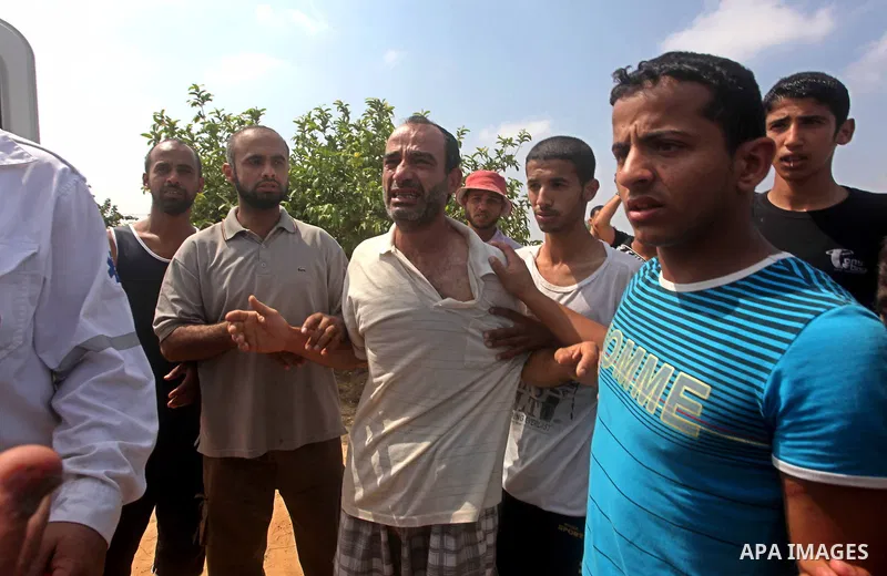 A relative of Palestinian Mohammed abu Maleg reacts after his body was recovered in Dir al-Balah in the central Gaza Strip June 19, 2012. An Israeli air strike killed two Palestinians, one of them abu Maleg, in the Gaza...
