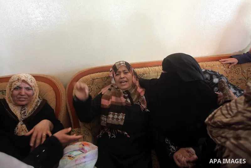 Relatives of Palestinian Mohammed abu Maleg mourn during his funeral in Al-Maghazi refugee camp in the central Gaza Strip June 19, 2012. An Israeli air strike killed two Palestinians, one of them abu Maleg, in the Gaza S...