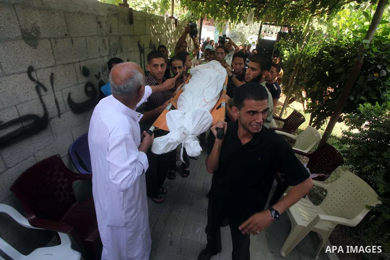 Relatives of Palestinian Mohammed abu Maleg mourn during his funeral in Al-Maghazi refugee camp in the central Gaza Strip June 19, 2012. An Israeli air strike killed two Palestinians, one of them abu Maleg, in the Gaza S...