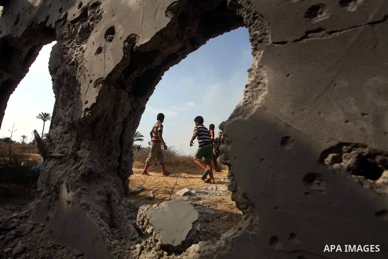 Palestinians inspect the place that was under an Israeli air strike in Dir al-Balah in the central Gaza Strip June 19, 2012. An Israeli army statement said the Israeli air force targeted Palestinian militants in the cent...