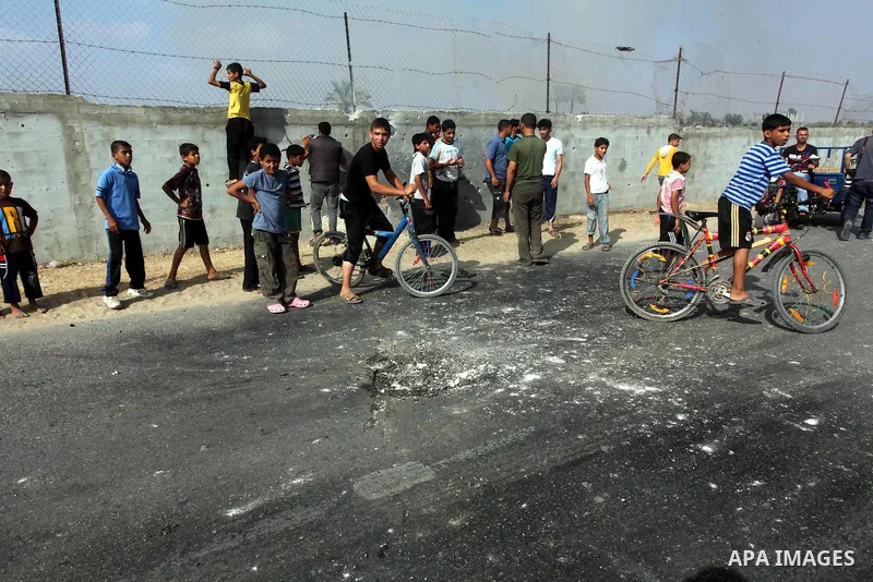 Palestinians inspect the place that was under an Israeli air strike in Dir al-Balah in the central Gaza Strip June 19, 2012. An Israeli army statement said the Israeli air force targeted Palestinian militants in the cent...