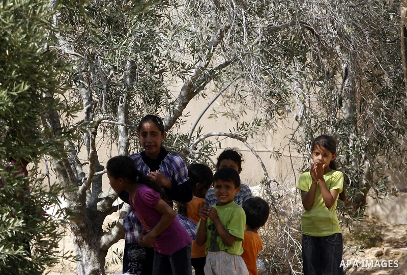 Relatives of Palestinian militant Galib Rmelat mourn during his funeral in Rafah in the southern Gaza Strip June 20, 2012. Israeli air strikes killed a Palestinian militant and a 14-year-old boy on Wednesday as fighting...