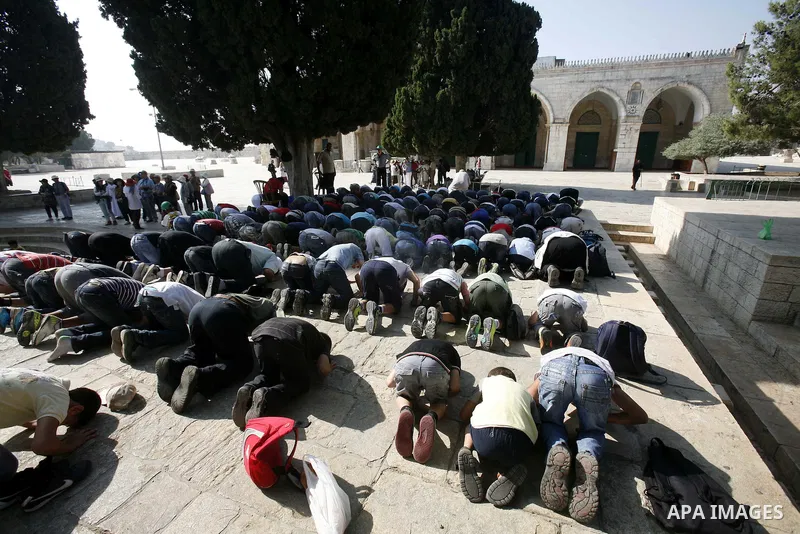 Palestinian children pray during a participate in summer camps at Al-Aqsa mosque in the old city of Jerusalem on 20 June 2012. Photo by Mahfouz Abu Turk