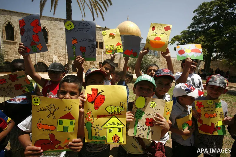 Palestinian children participate in summer camps at Al-Aqsa mosque in the old city of Jerusalem on 20 June 2012. Photo by Mahfouz Abu Turk.