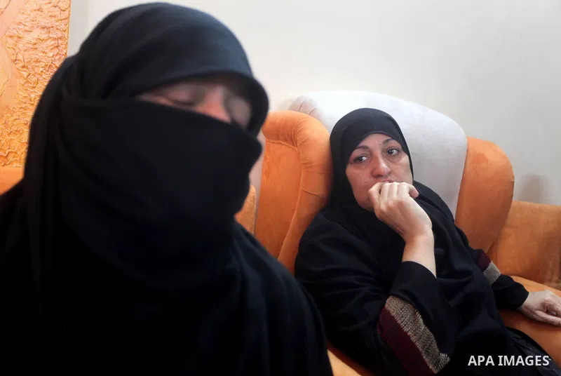 Palestinian Relatives of 14-year old Moamen al-Adam, who was killed in an Israeli air strike the day before, mourn as they watch his funeral procession in Gaza city on June 21, 2012. The latest attacks follow three days...