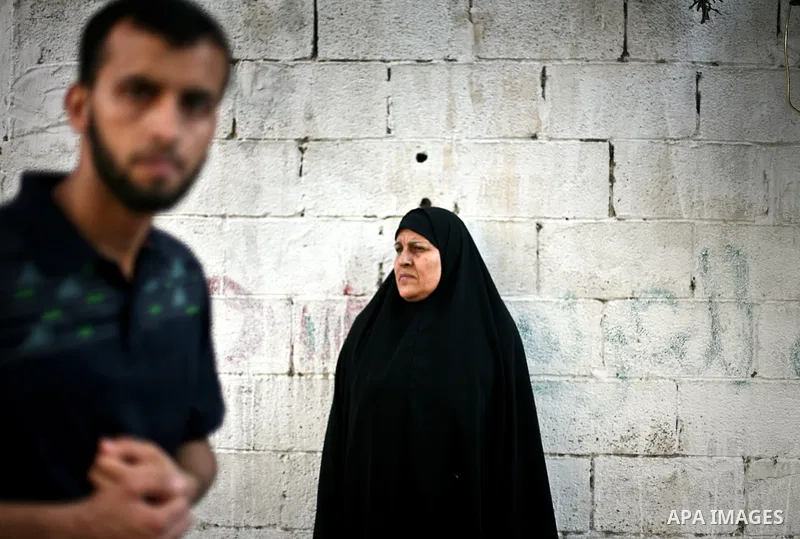 A relative of Thair Al-Baik, a Palestinian militant from the Al-Qassam brigades, the armed wing of the Hamas movement, mourns during his funeral in Jabalya, in the northern Gaza Strip June 21, 2012. The bodies of two mil...