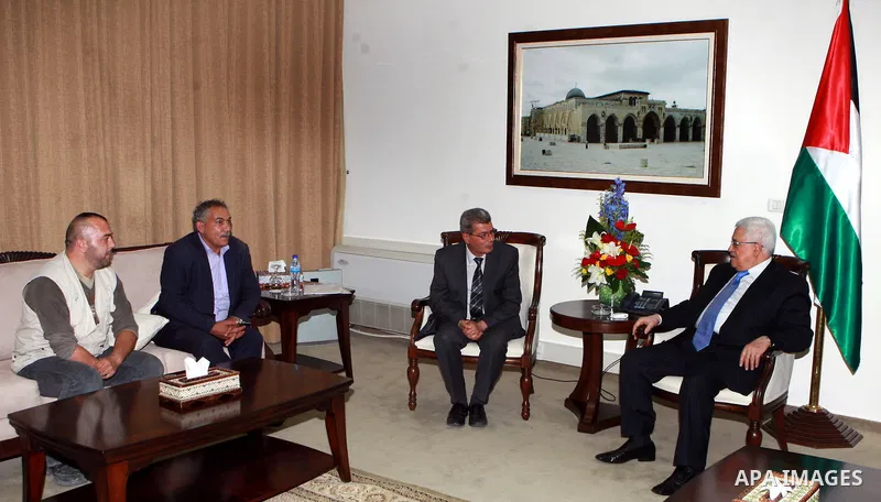 Palestinian President, Mahmoud Abbas (Abu Mazen) meets with released prisoner Hamzeh Oudeh, in the West Bank city of Ramallah, on June 21, 2012. Photo by Mohammed al-Atiq