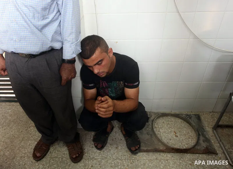 Relatives of wounded Palestinians mourn, at al-Aqsa hospital following an Israeli airstrike east of Bureij refugee camp, in Deir Al Balah, central Gaza strip, Friday, June 22, 2012. An Israeli air strike killed a Palesti...