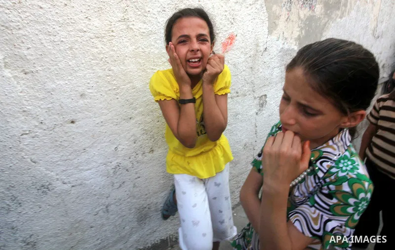 Relatives of Palestinian militant Basil Ahmed mourn during his funeral in Bureij refugee camp, central Gaza Strip, Friday, June 22, 2012. Palestinian sources say that Ahmad was killed during an Israeli airstrike east of...