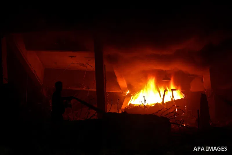 Hamas Police and firemen look at the damages and try to put out a fire at the al-Saraya Security complex following an Israeli air strike on Gaza on June 23, 2012. Israel launched more air strikes against on the Gaza Stri...