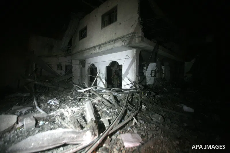 A Palestinian Hamas security personnel inspects the destroyed Al Saraya compound after its was hit in an Israeli air strike in the central Gaza city, early 23 June 2012. Israeli war jets killed two Palestinian militants...